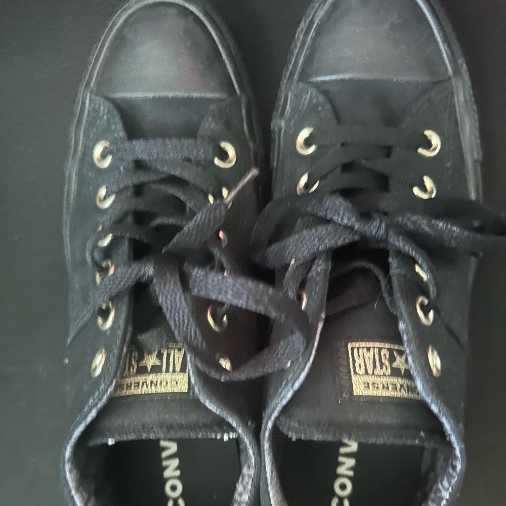 Woman converse sneakers black with gold accents
